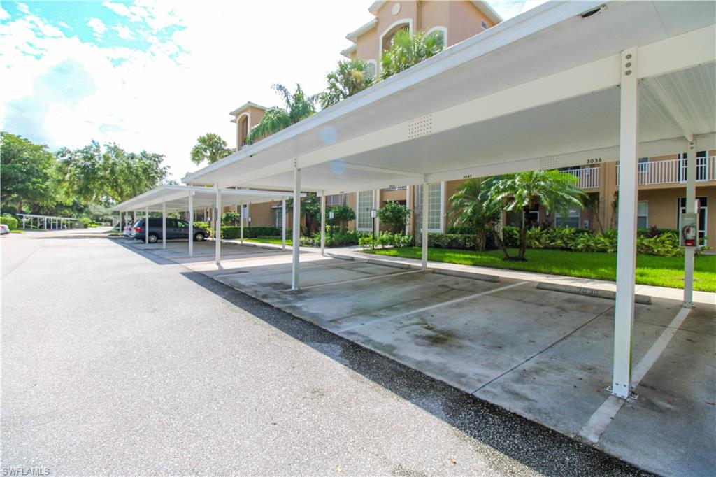 View of car parking featuring a carport