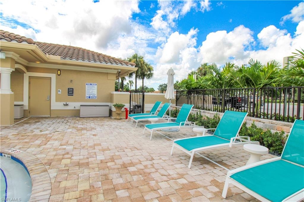 View of patio with a swimming pool