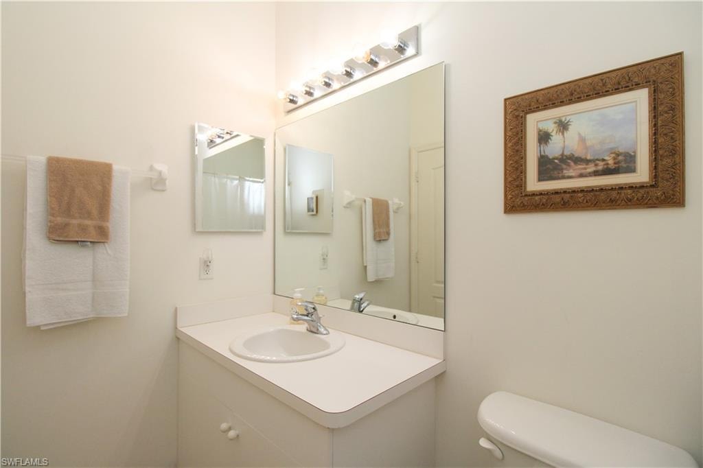 Bathroom featuring vanity and toilet