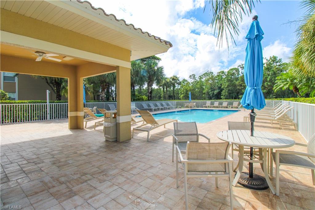 View of pool featuring ceiling fan and a patio