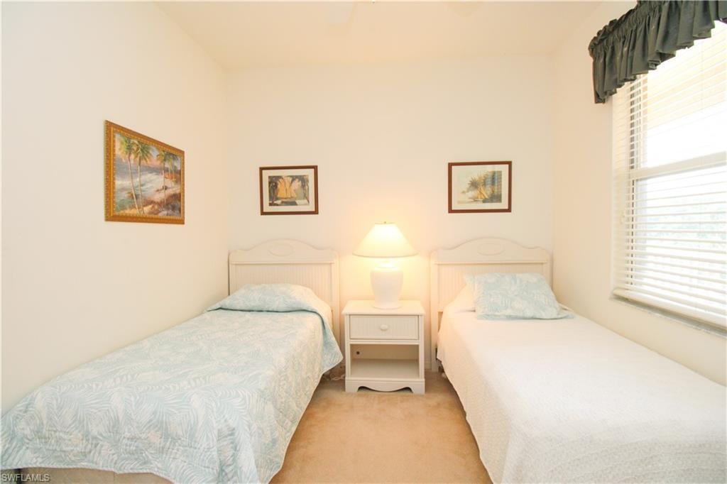 Bedroom with light carpet
