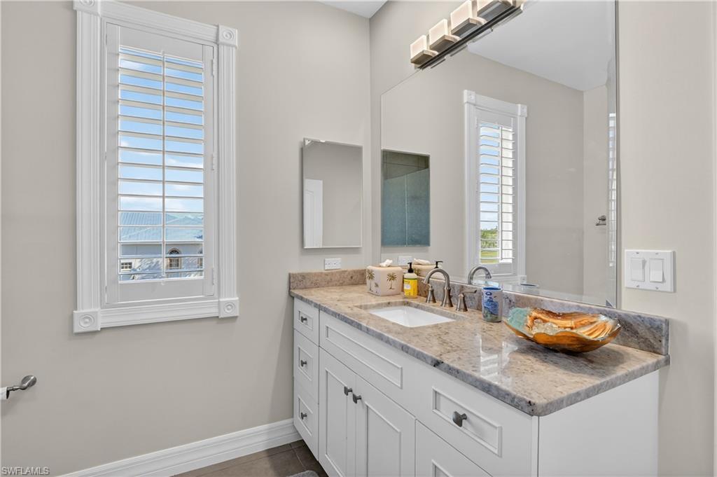 Bathroom with vanity and baseboards