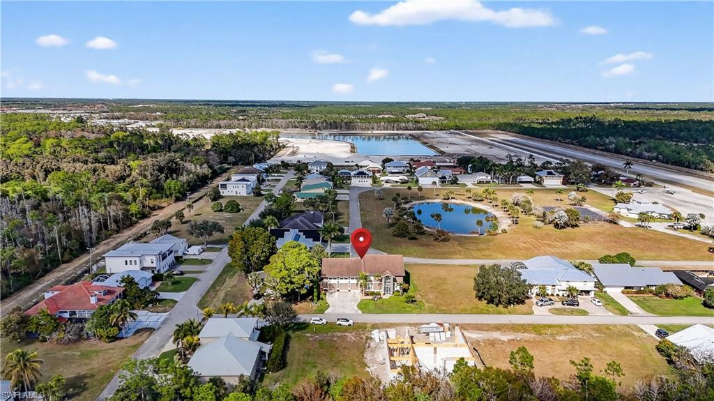 Aerial view of residential area featuring a large body of water