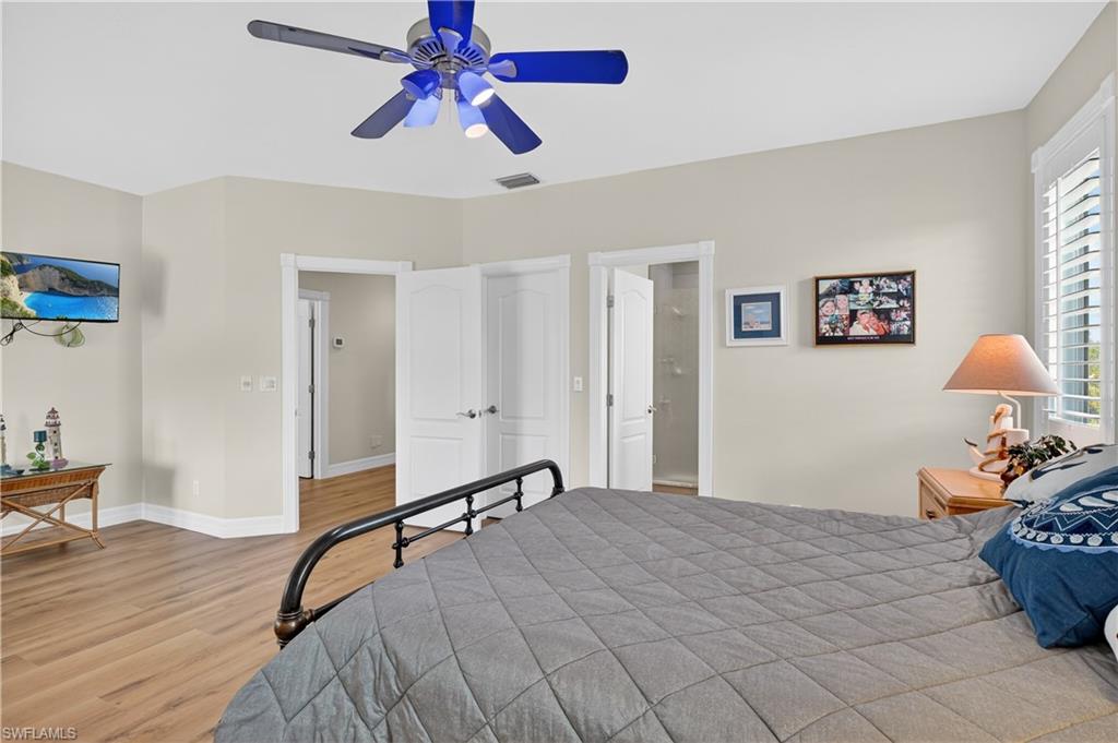 Bedroom featuring light wood-style floors and a ceiling fan