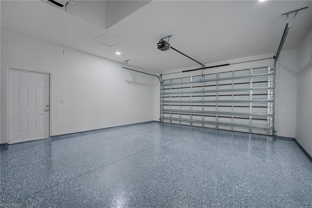 Garage featuring a garage door opener