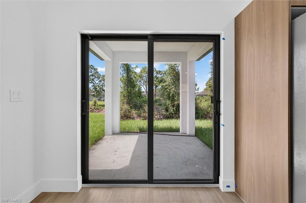Sliding glass door leading to a covered patio