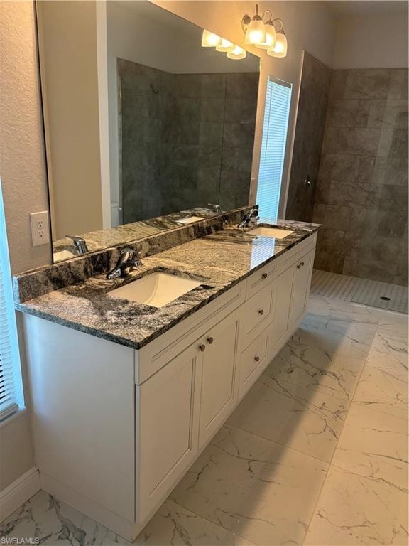 Bathroom featuring dual vanity and tile floors
