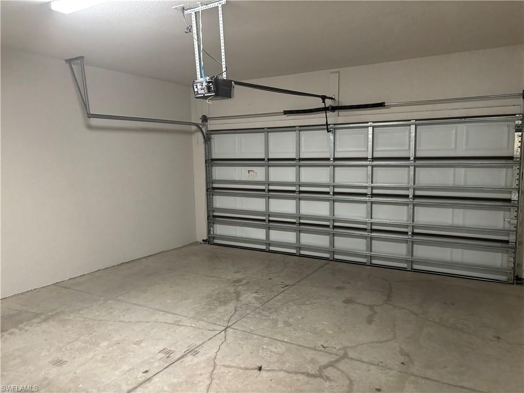 Garage featuring a garage door opener