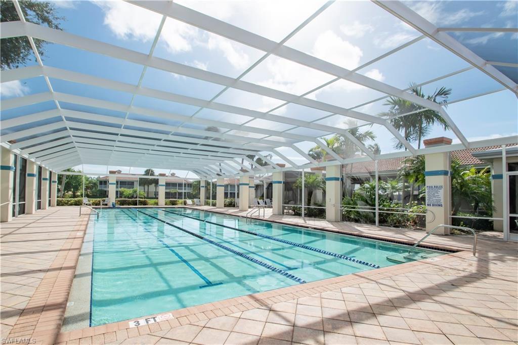 View of swimming pool featuring a patio and a lanai