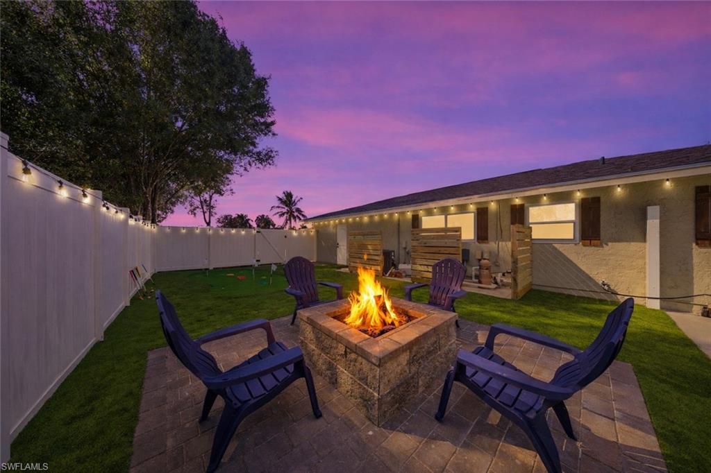 Paver patio featuring a stone-finish fire pit