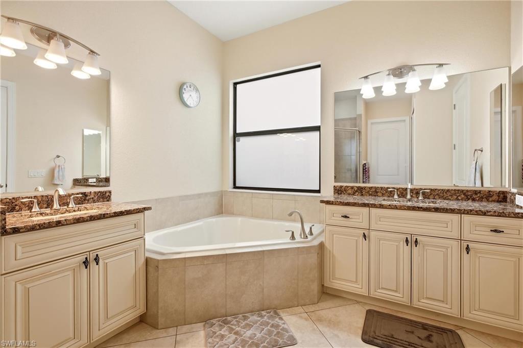 Master Bath showing dual sinks and tub