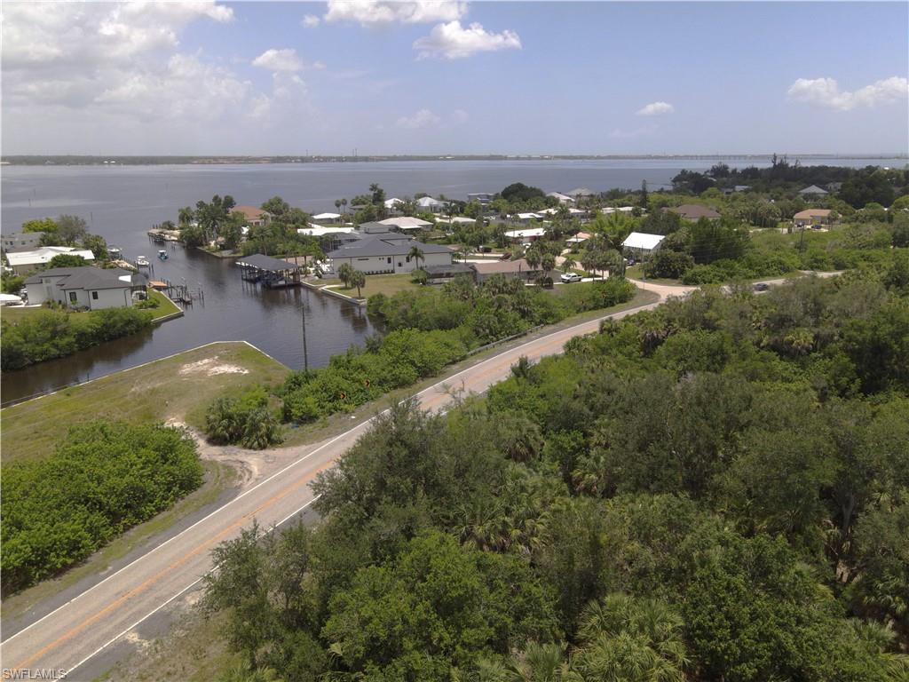 Partial view of lot including neighboring homes in background
