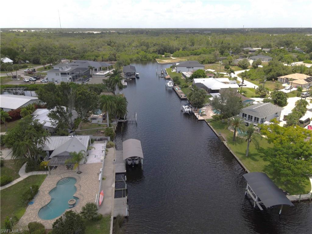 Aerial View from the Peace River looking down the canal. 25301 Harborview Rd. is in the background on the right of the main canal