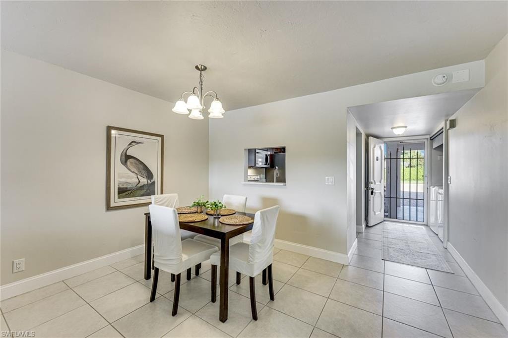 Dining room has a pass through to the kitchen. From the kitchen you have lake views while doing dishes.
