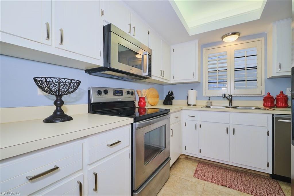 Kitchen is complete with stainless steel appliances.