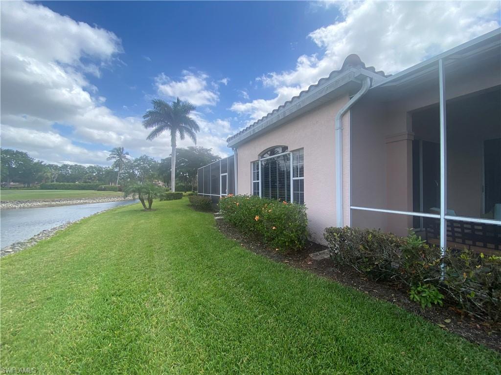 View of yard with a water view