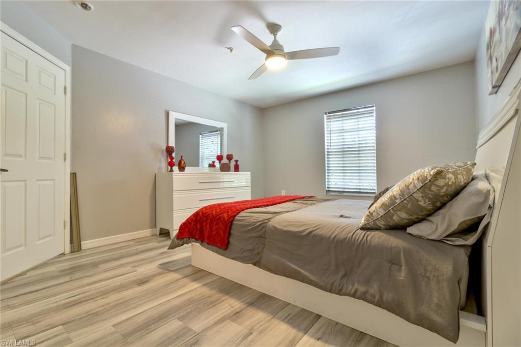 Bedroom featuring ceiling fan and light hardwood / wood-style floors