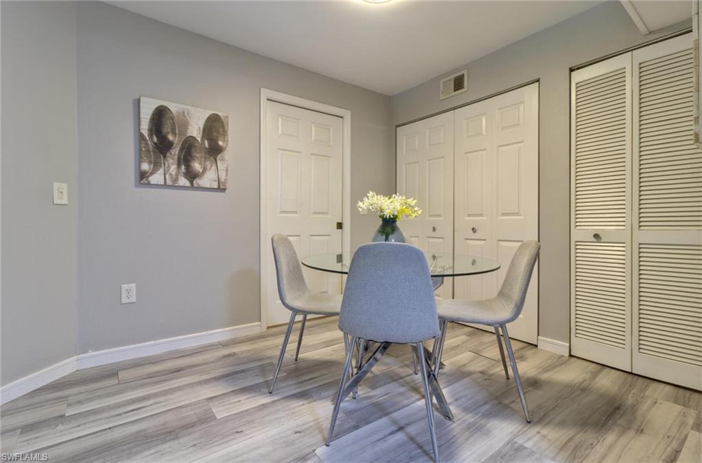 Dining area with light hardwood / wood-style floors