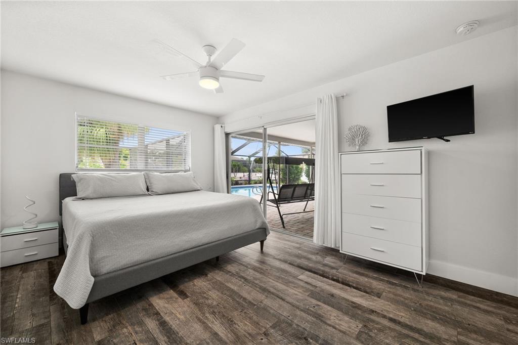 Master Bedroom with sliding door directly to the lanai / pool area