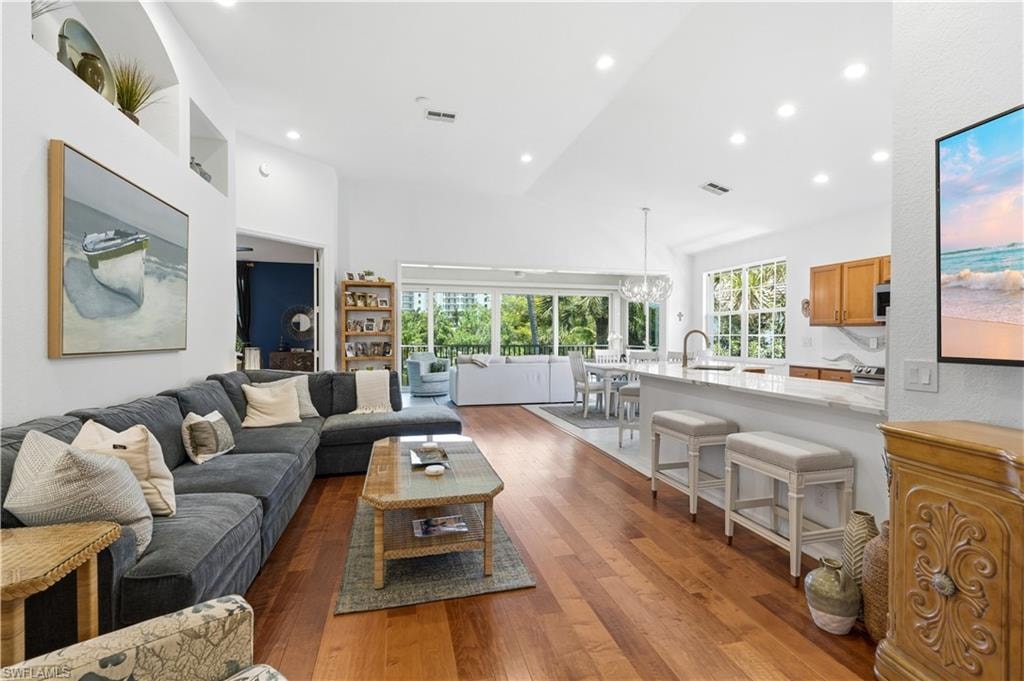Large, open great room room opens to the glass enclosed lanai overlooking the lake.