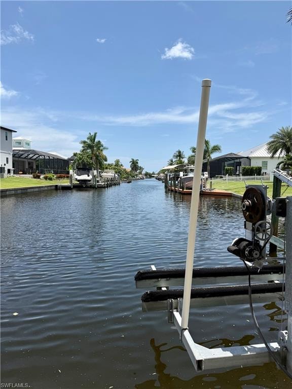 Waterfront property with direct canal access featuring a private boat lift