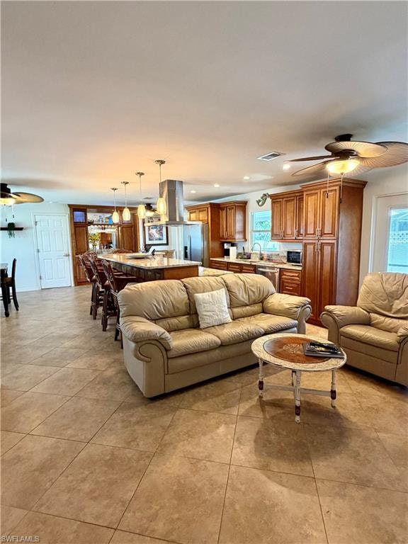 Open-concept living area featuring tile flooring throughout