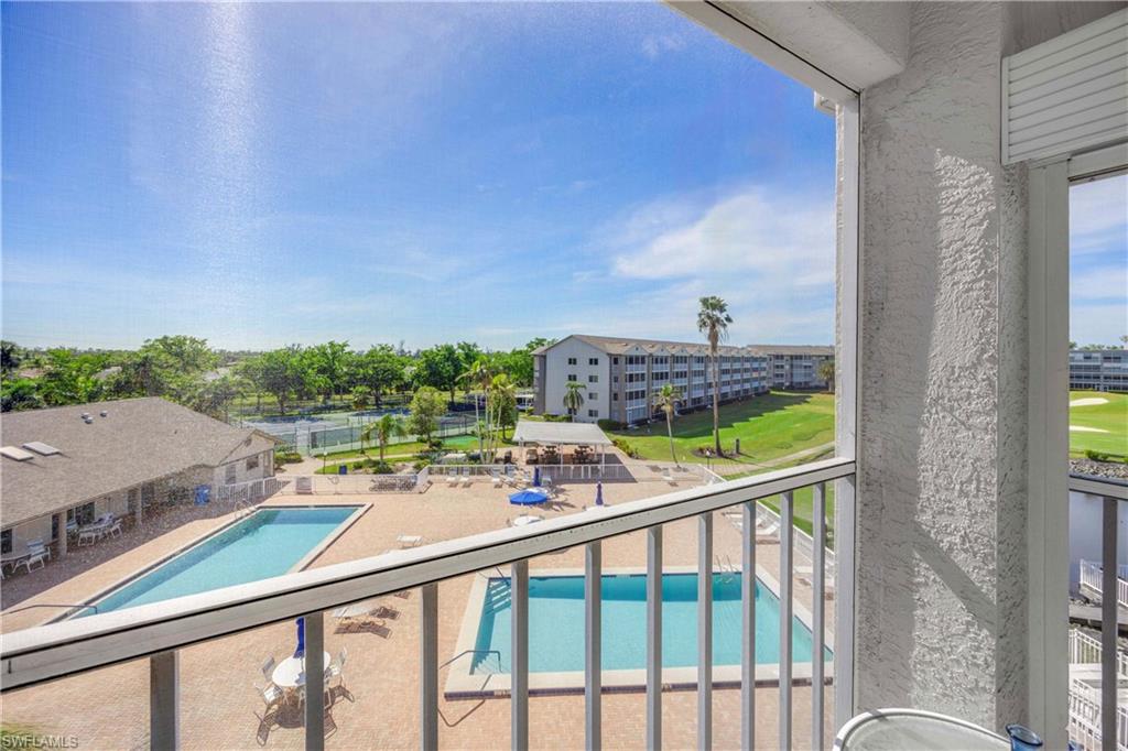 Community pool with a balcony