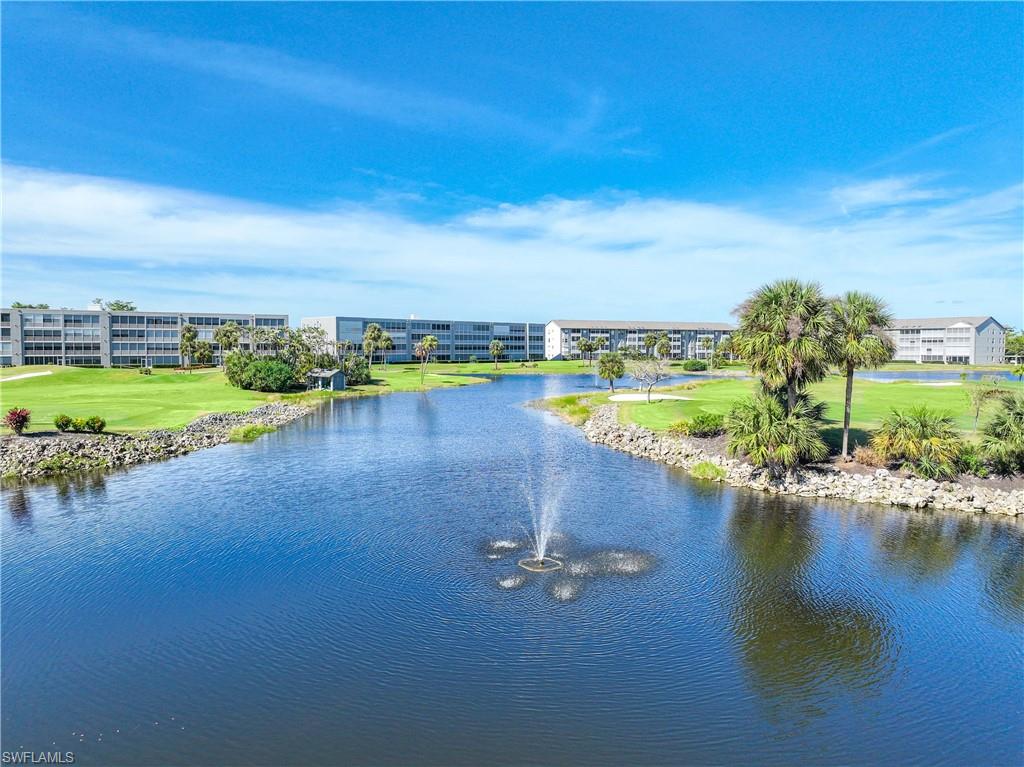 Water view with a golf course