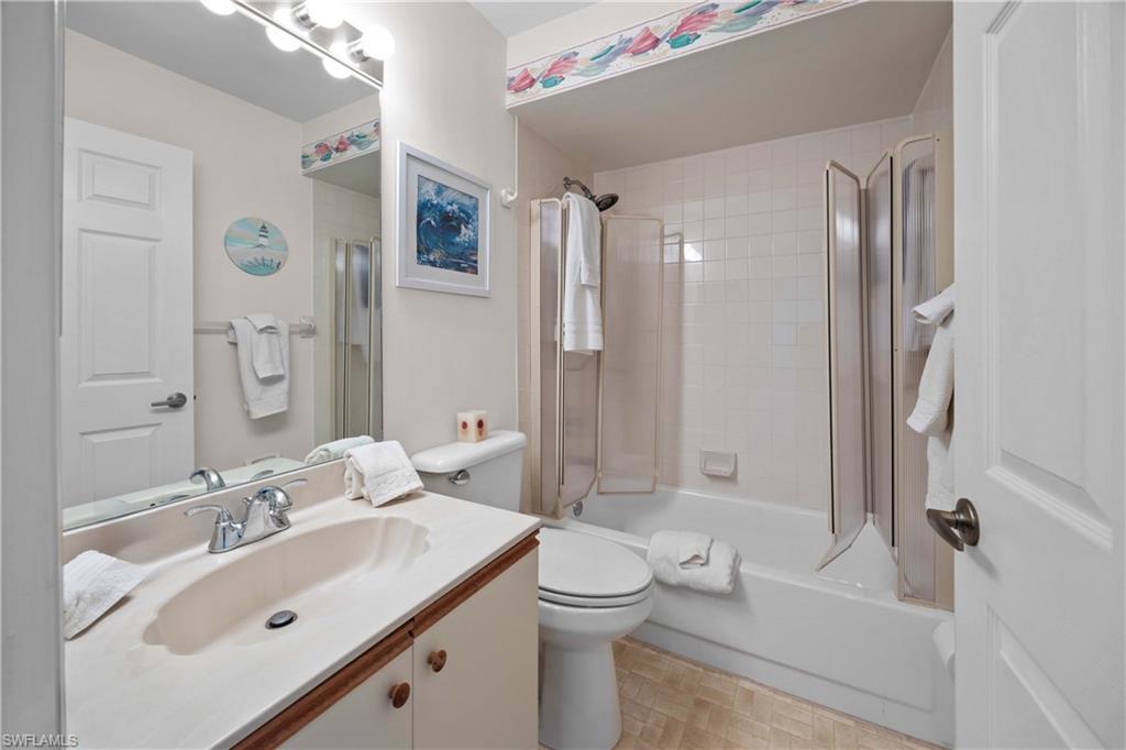 Bathroom featuring vanity and shower / washtub combination