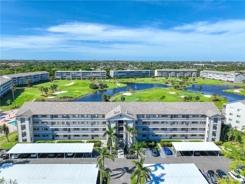 Aerial view of apartment complex and a golf club