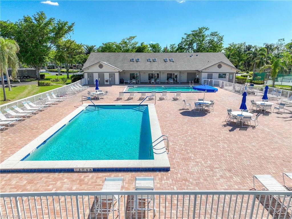 Community pool with a patio