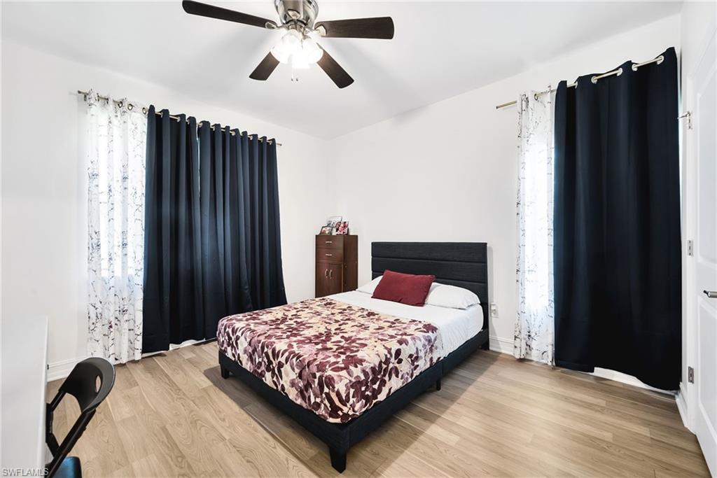White walls complemented by wood-finish flooring