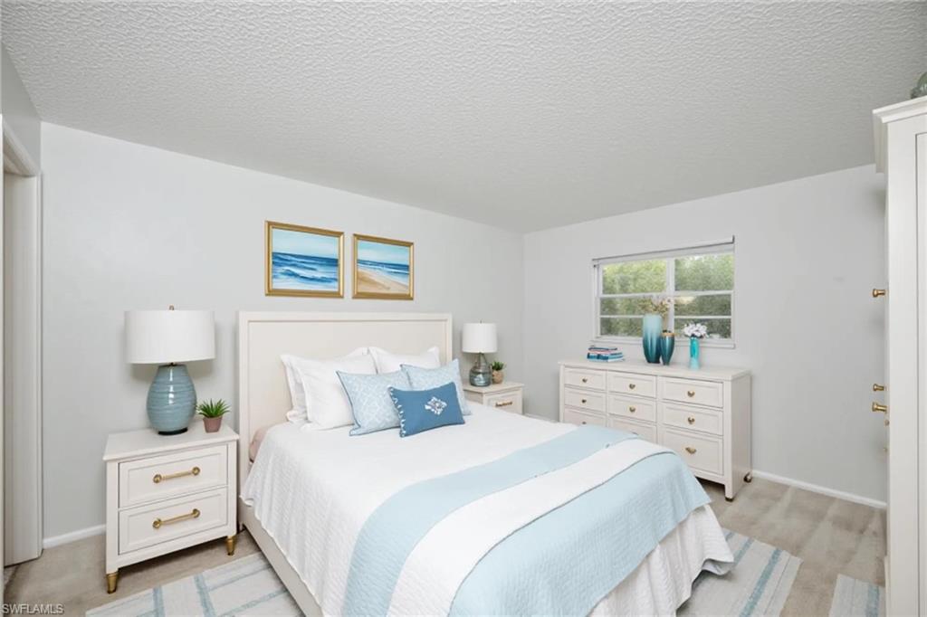 Virtually staged photo showing primary bedroom.