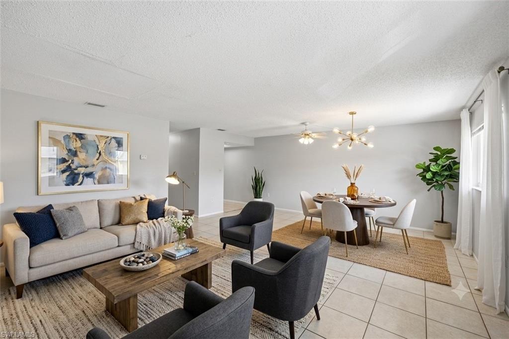 Virtually staged photo showing living and dining area.