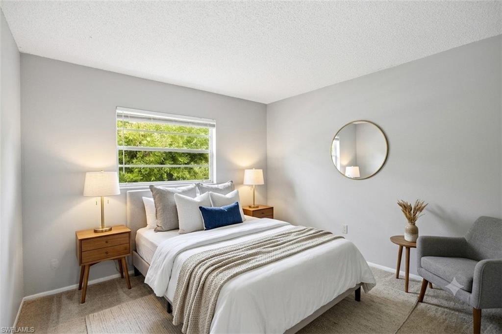 Virtually staged photo showing guest bedroom.