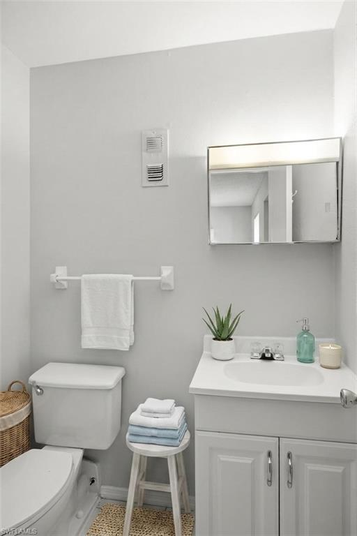 Virtually staged photo showing primary half bathroom.