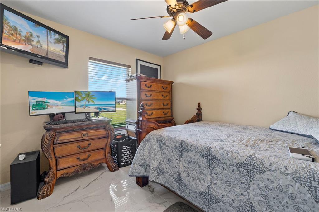 Light-toned walls complement the white-hued tile flooring