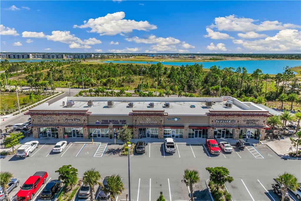 Birds eye view of property featuring a water view