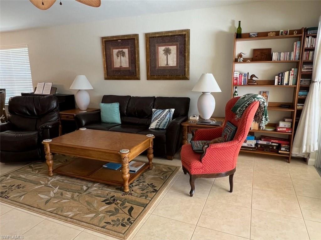 Tiled living room with ceiling fan