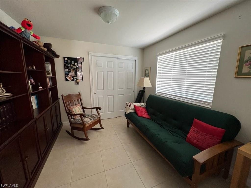 Living area with light tile patterned flooring