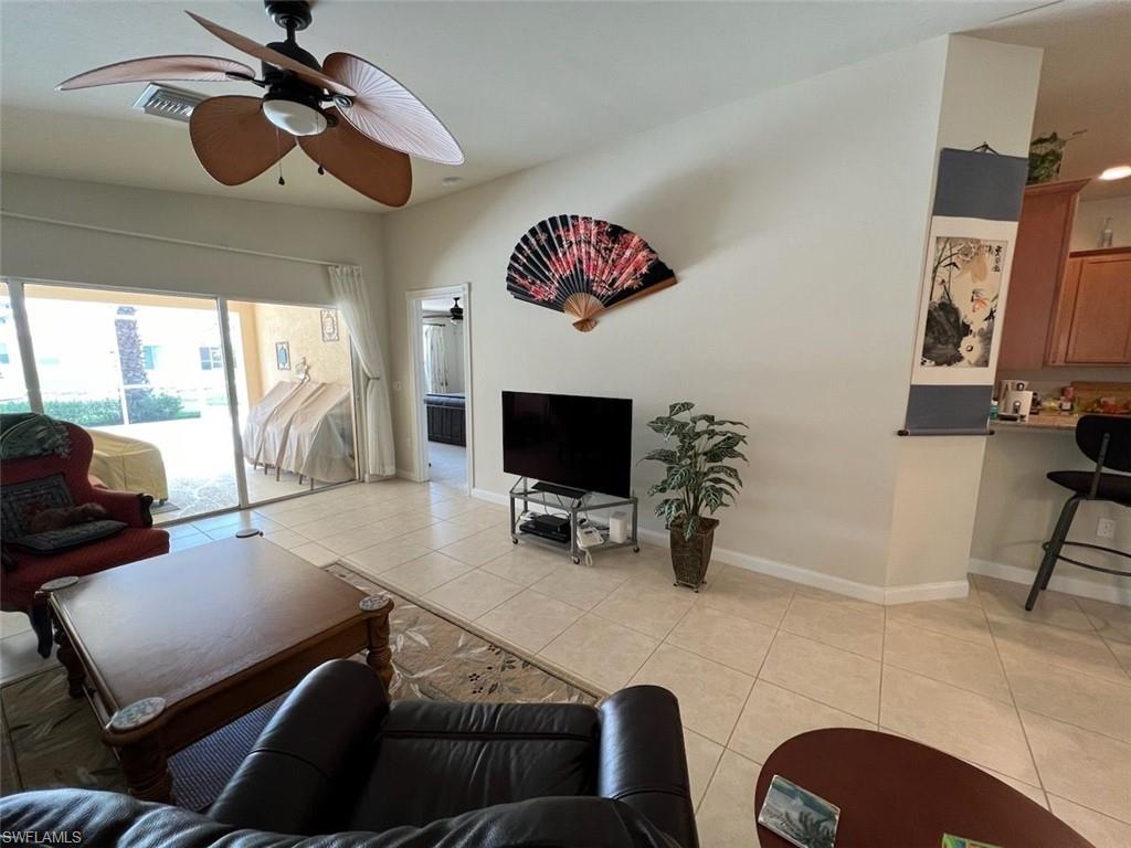 Tiled living room with ceiling fan
