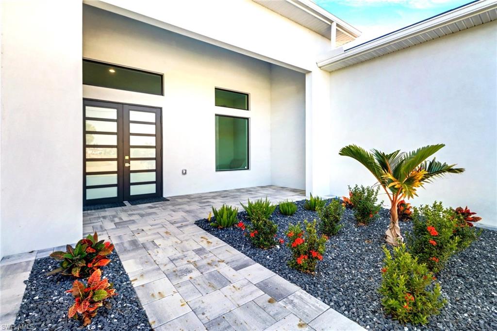 Contemporary exterior with white stucco finish