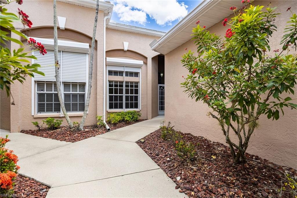 Front Entrance is protected and screened in. Windows to the left are the guest bedroom.