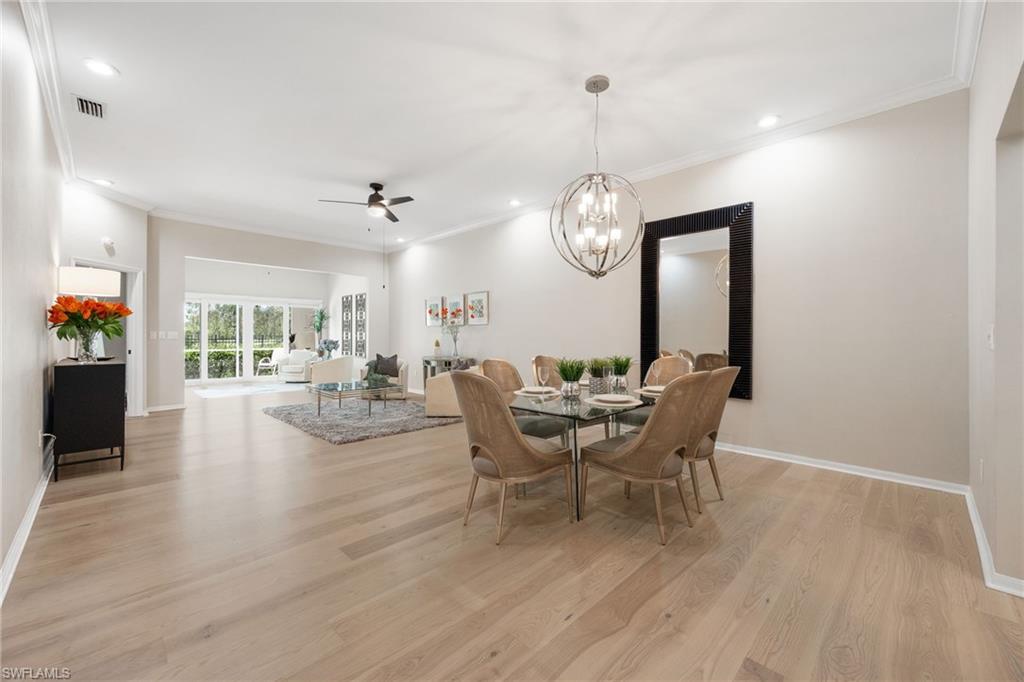Just WOW! Gorgeous space and room ~ recessed lighting, ceiling fans thoughout, crown molding, 10 ft ceilings.  There is dining, living room, a gathering space in the back and screened lanai. Perfect for entertaining and relaxing.