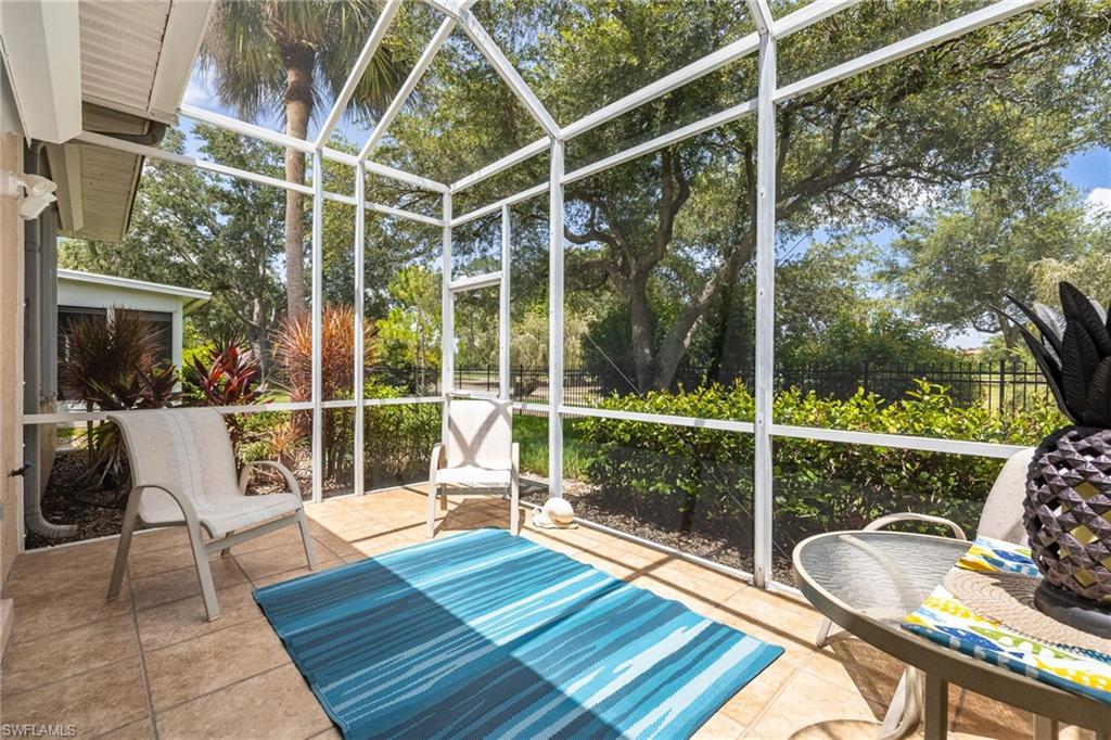 Screened Lanai with tile flooring. Mature landscaping and beautiful view of the golf course.