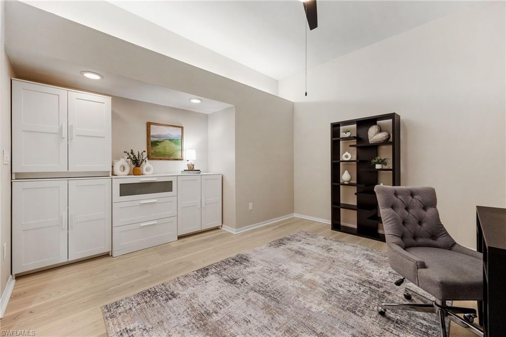 Den - owner added a full wall of shelves/storage. Painted neutral - loads of flexibility to have a combo office, guest room, sports room etc.