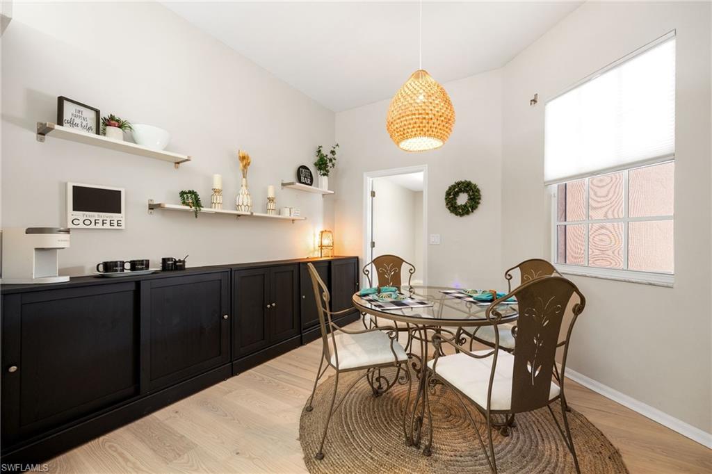 Client added a full wall of storage in the "Breakfast Nook". Great for a coffee/beverage bar! Door leads to huge laundry room.