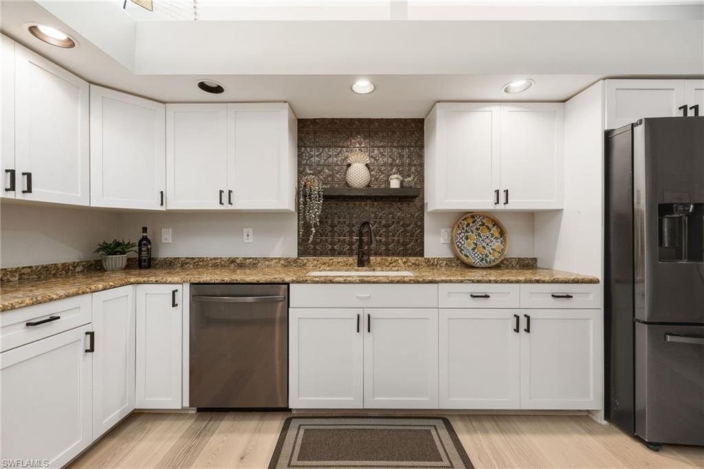 The cabinets have all be refaced, recessed lights added.