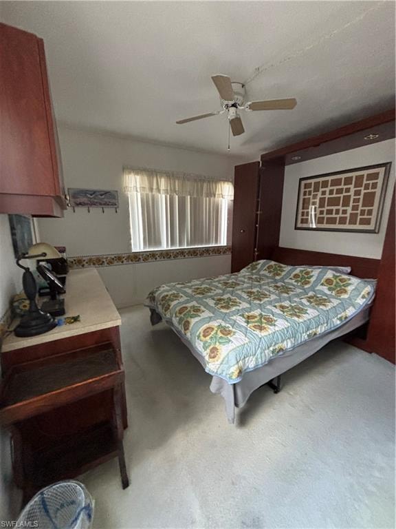Wall-mounted bed frame with integrated cabinetry and overhead storage