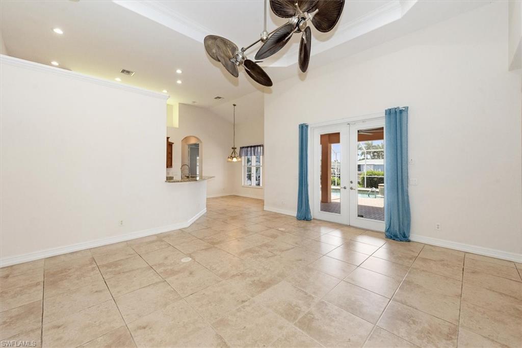 Unfurnished room with ceiling fan, french doors, recessed lighting, arched walkways, and ornamental molding